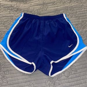 Blue Nike athletic shorts